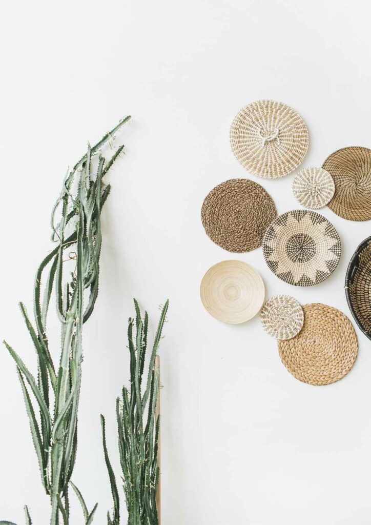 Woven baskets and greenery against a soft neutral wall — representing balance, simplicity, and Ikigai Wealth’s approach to retirement planning.