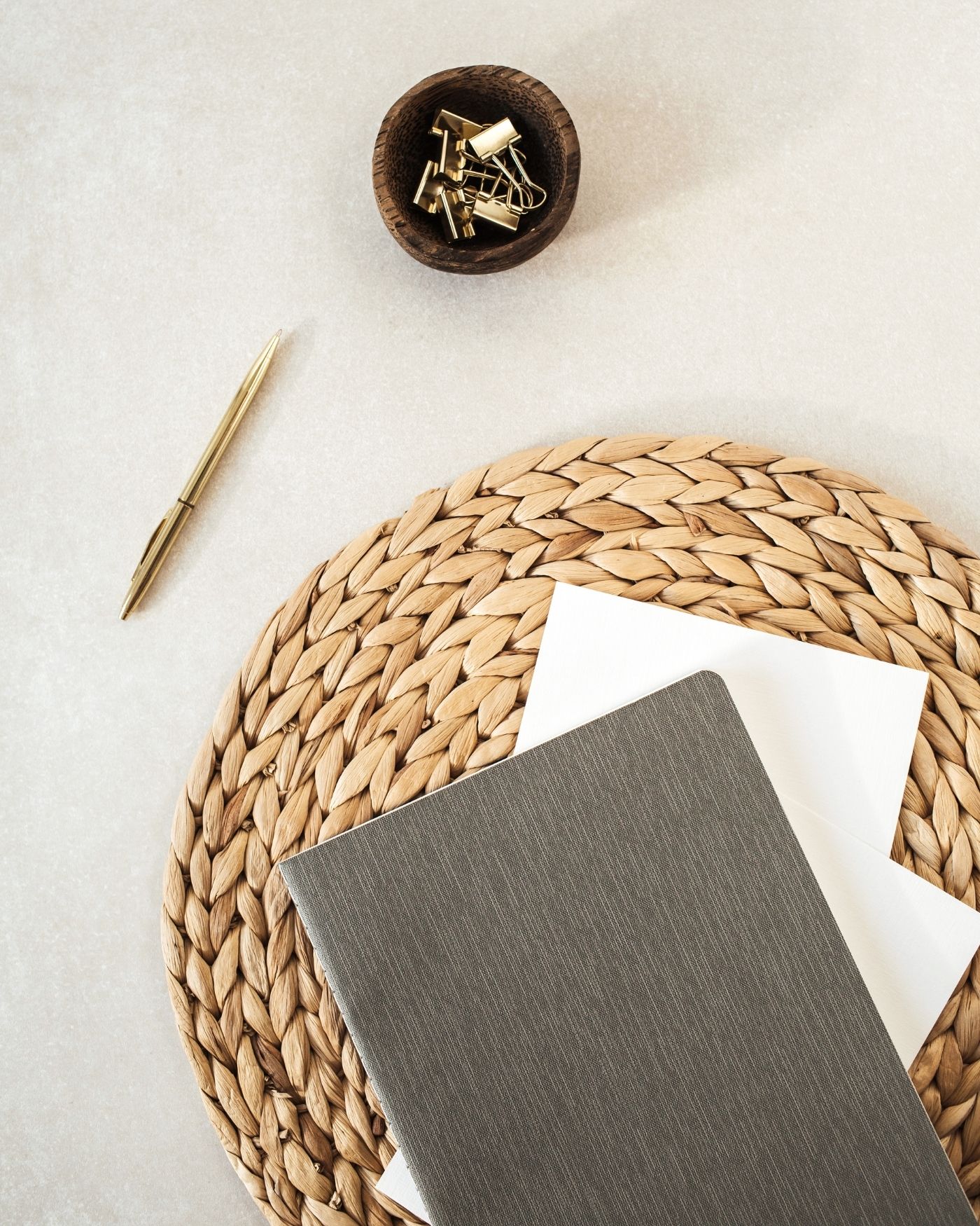 Notebook and pen representing a personalised private wealth strategy tailored to long-term financial goals.